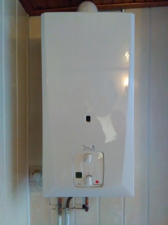 Installation d'un chauffe bain gaz Saunier mural.
